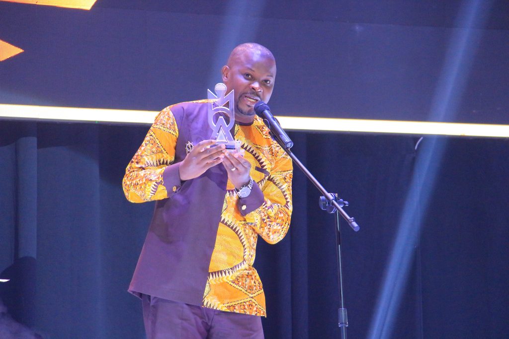 NTV's Andrew Kyamagero accepting his award for the 2019 Bbale Francis Best Male News Anchor.